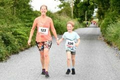 Mother and son Angie and Ronan Hartnett, Kilmaine crossing the finish line together at the Castlehackett 8k.